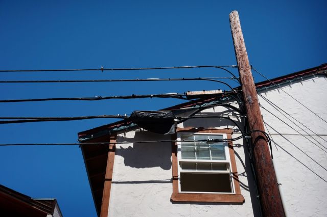 Power lines connected to a house.