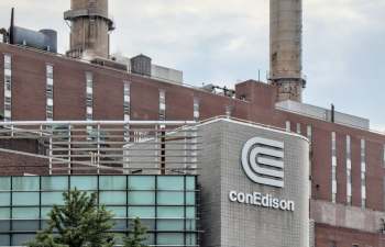 The conEdison building features a prominent logo, with industrial structures and smokestacks in the background.