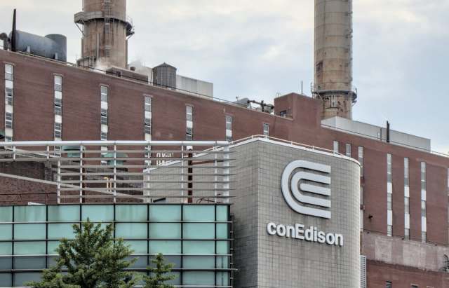The conEdison building features a prominent logo, with industrial structures and smokestacks in the background.