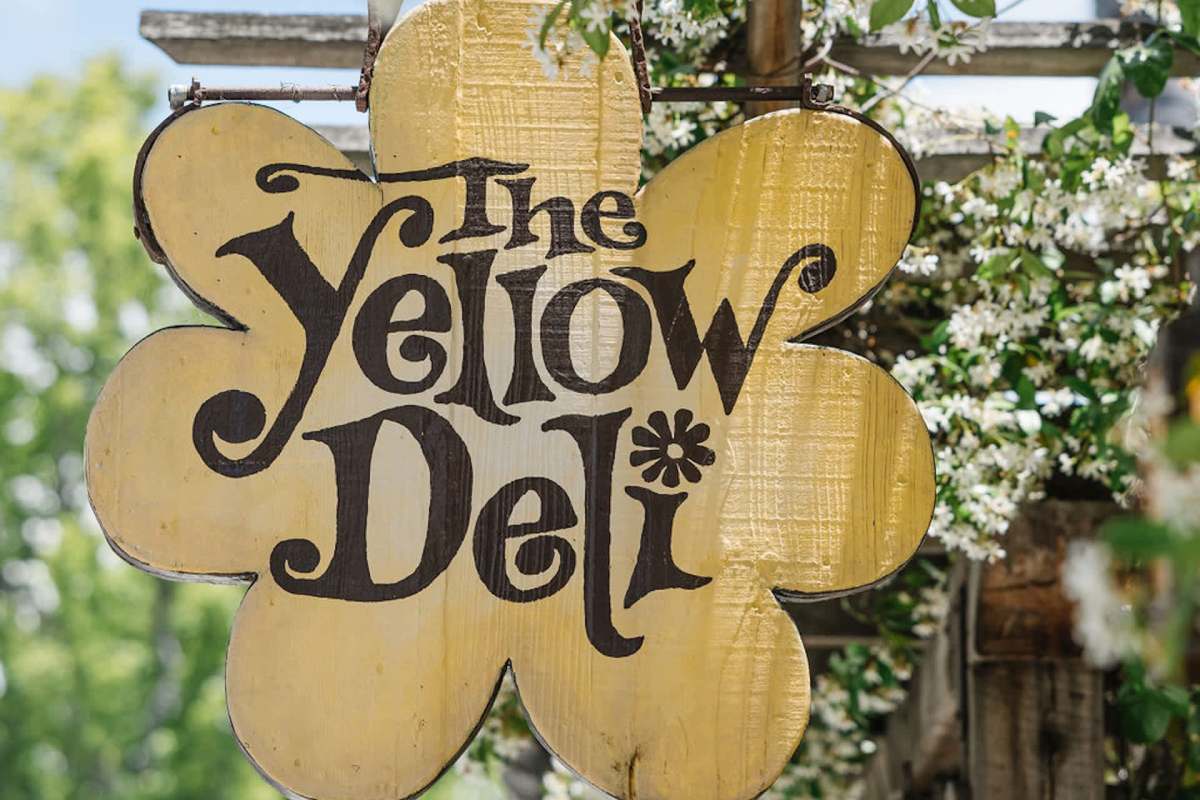 The Yellow Deli restaurant sign
