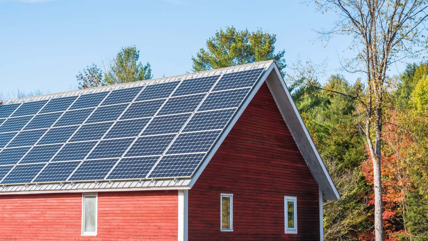 A red barn with a solar roof.