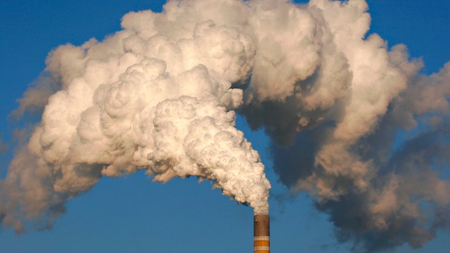 Smoke coming out of a smokestack.
