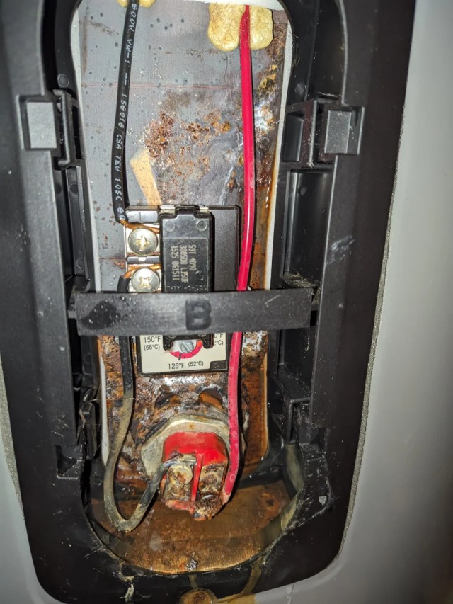 A rusted water heater. 