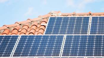 Solar panels on a tile roof.