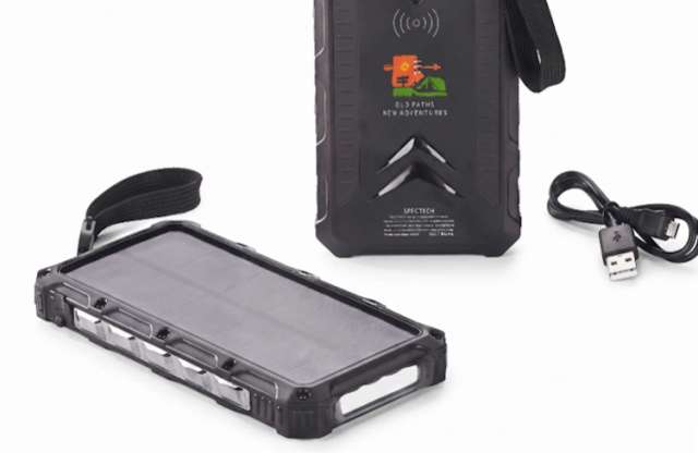 A portable solar charger with a USB cable and a strap for carrying.