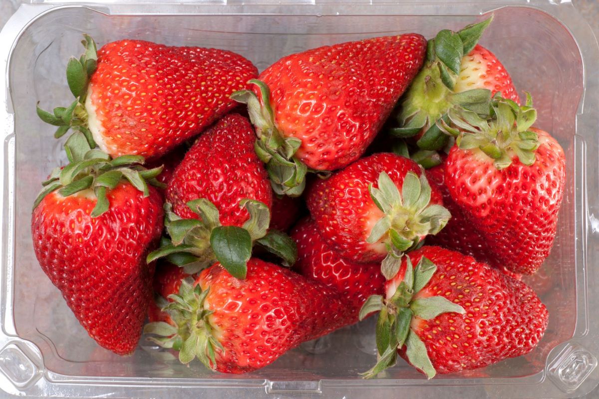 A container of strawberries.