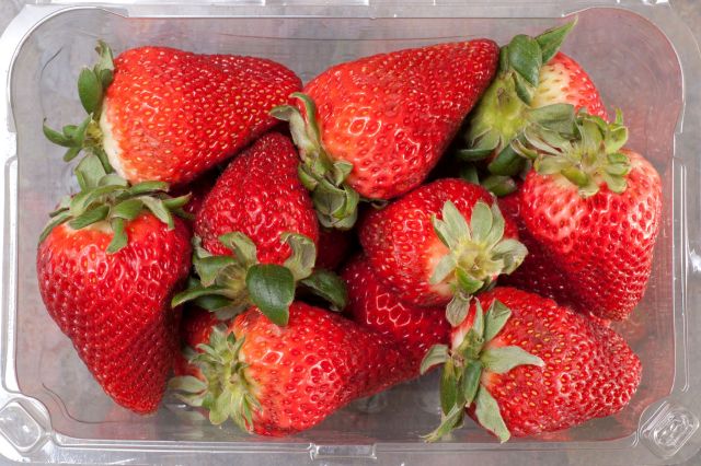 A container of strawberries.