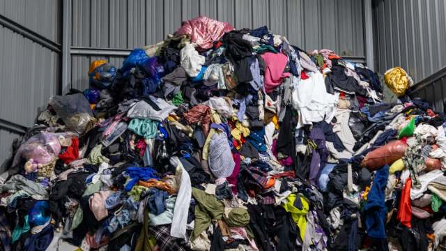 A disorganized pile of clothing at a storage facility.