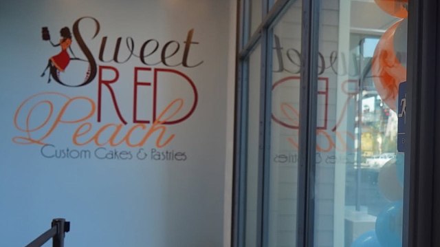 A storefront sign for "Sweet Red Peach" features custom cakes and pastries, with decorative balloons nearby.