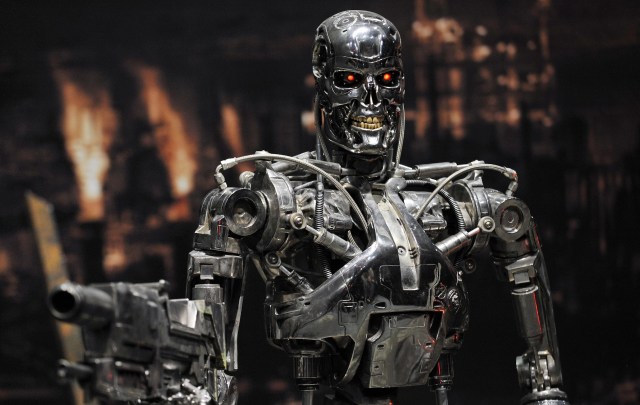 A humanoid robot with glowing red eyes from the film The Terminator.
