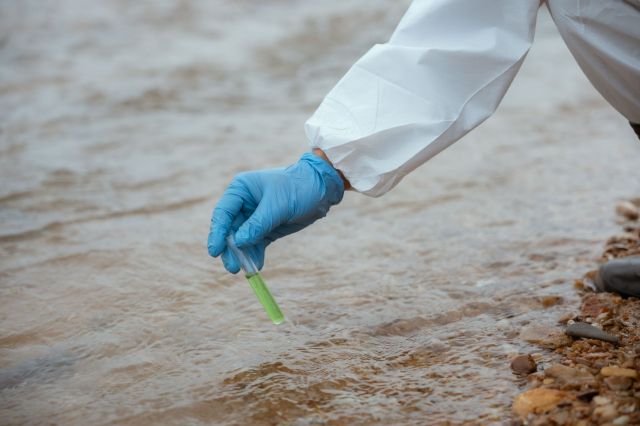 Taking a water sample.