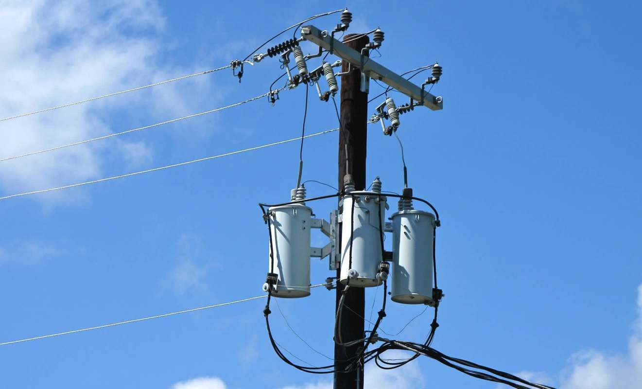 A utility pole with distribution transformers.
