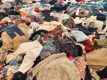 A large pile of assorted clothing items.