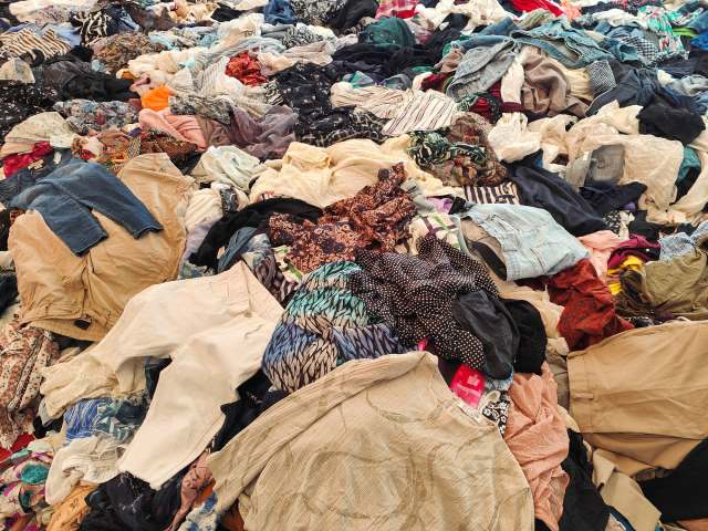 A large pile of assorted clothing items.