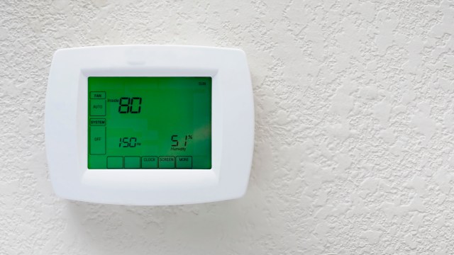 A thermostat displaying an indoor temperature of 80°F and humidity at 51%.