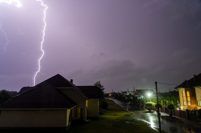 A heavy thunderstorm in a neighborhood.