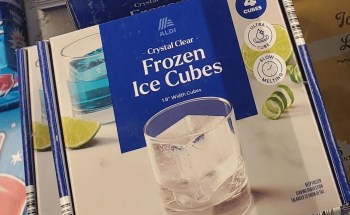An Aldi-branded package of crystal clear frozen ice cubes.