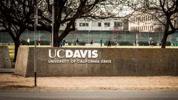 A large sign displaying "UC Davis, University of California, Davis."