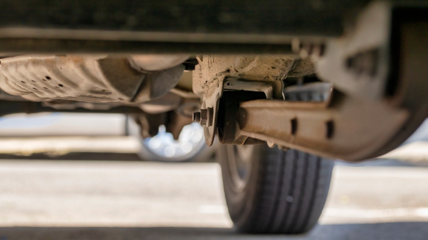 An underneath view of a vehicle's suspension system.