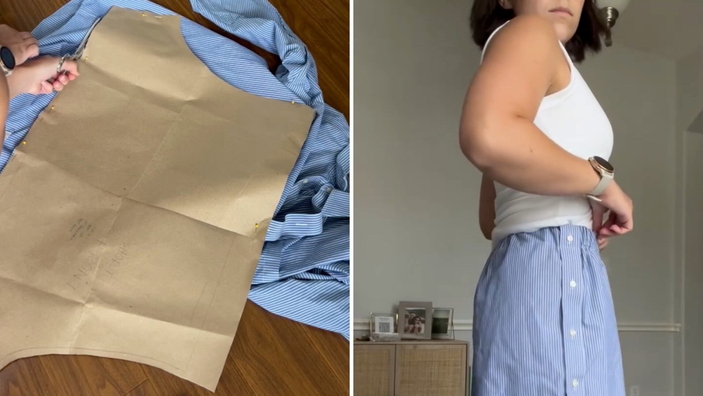 A person is cutting fabric with scissors while trying on a blue and white striped skirt.