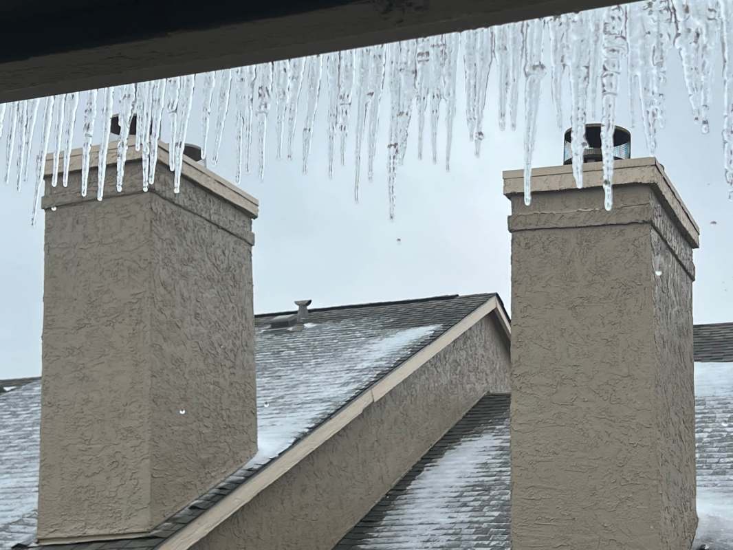 Icicles hanging from a roofline.