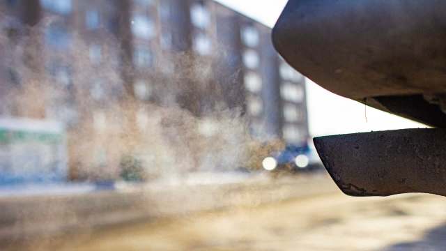 A vehicle's exhaust pipe releasing pollution.