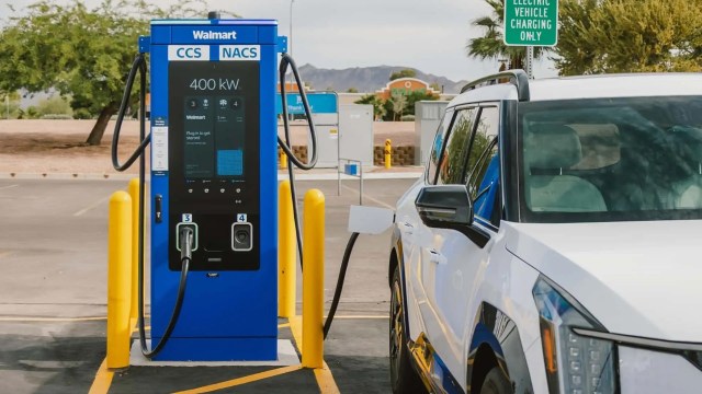 An electric vehicle using a charging station at Walmart.