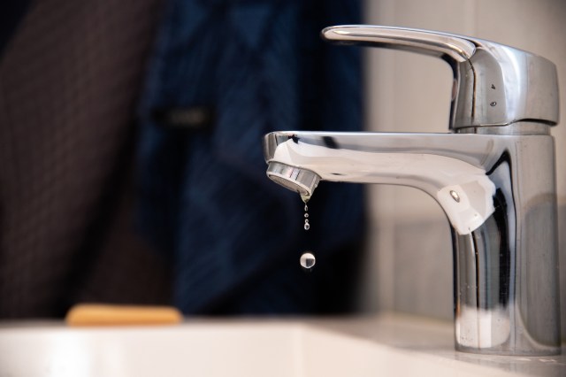 A faucet dripping water.