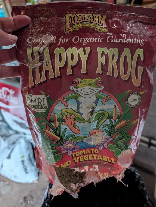 A damaged bag of fertilizer.