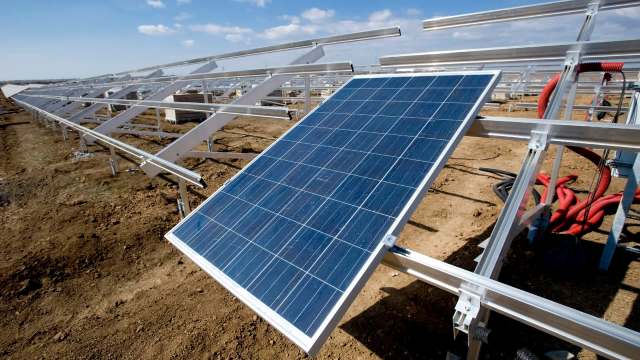 A solar panel on a mounted array under construction.