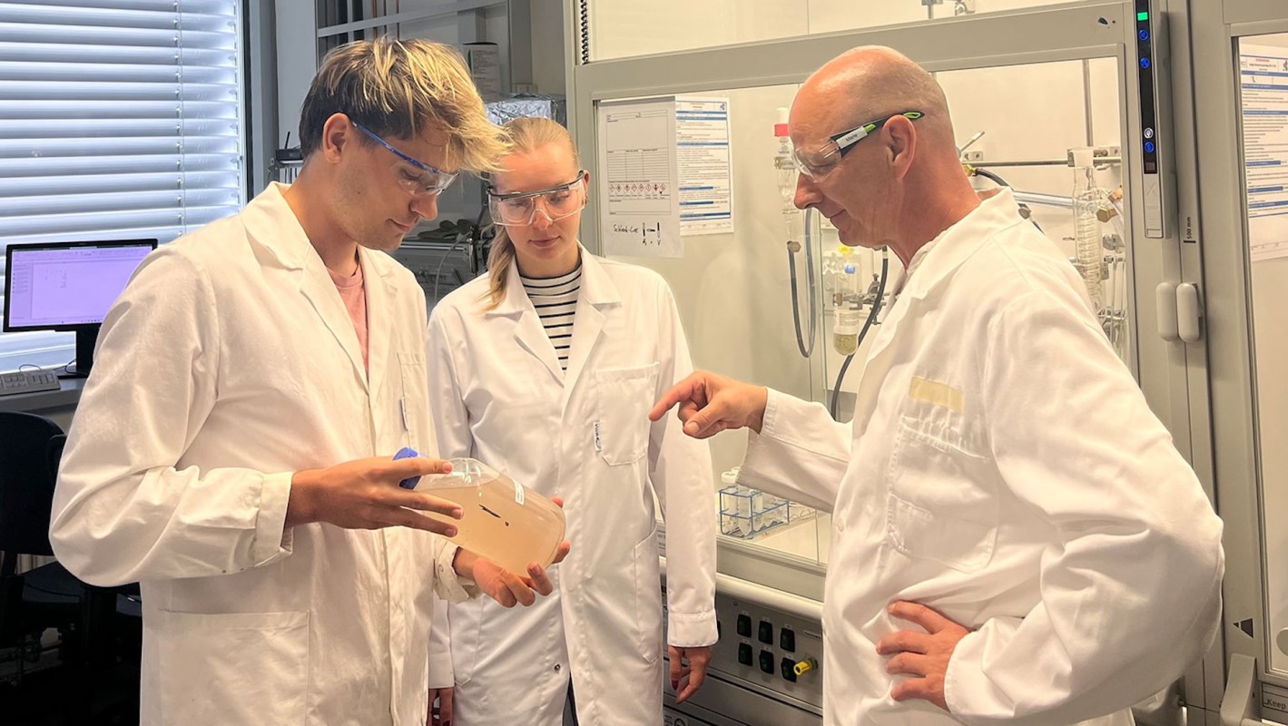 Three researchers in a lab.