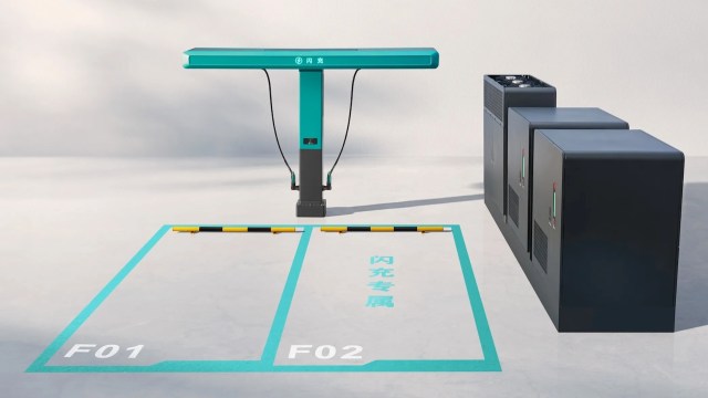 An electric vehicle charging station with marked parking spots and connected cables.