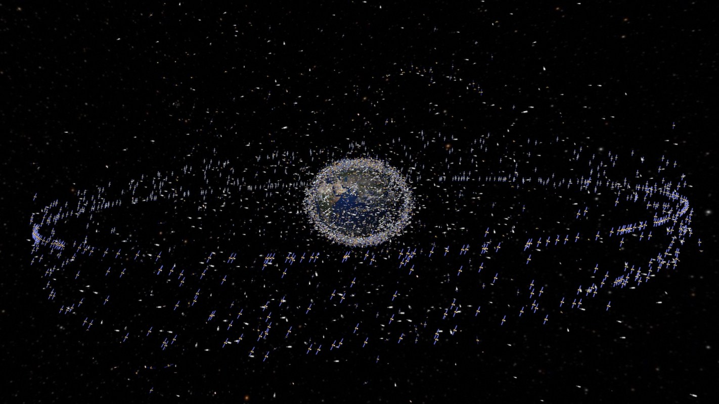 A view of Earth surrounded by numerous satellites and space debris in orbit.