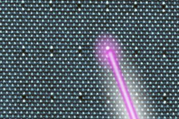 A pink laser beam directed at a textured surface featuring a grid pattern.