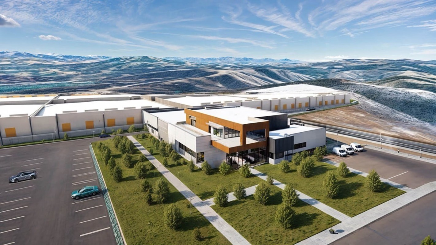 A rendering of a data center with a parking lot and landscaped area in a mountainous landscape.