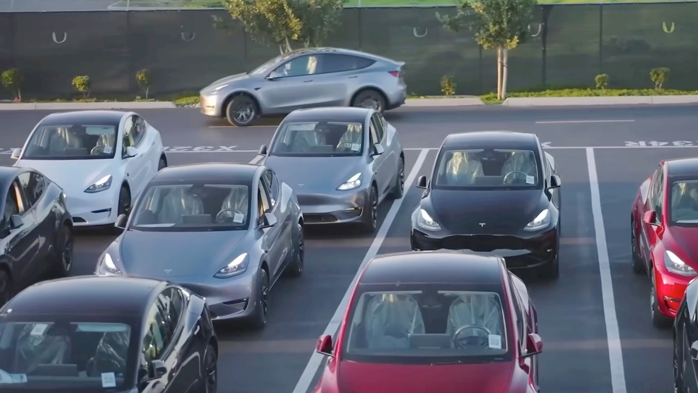 A parking lot with Tesla vehicles.