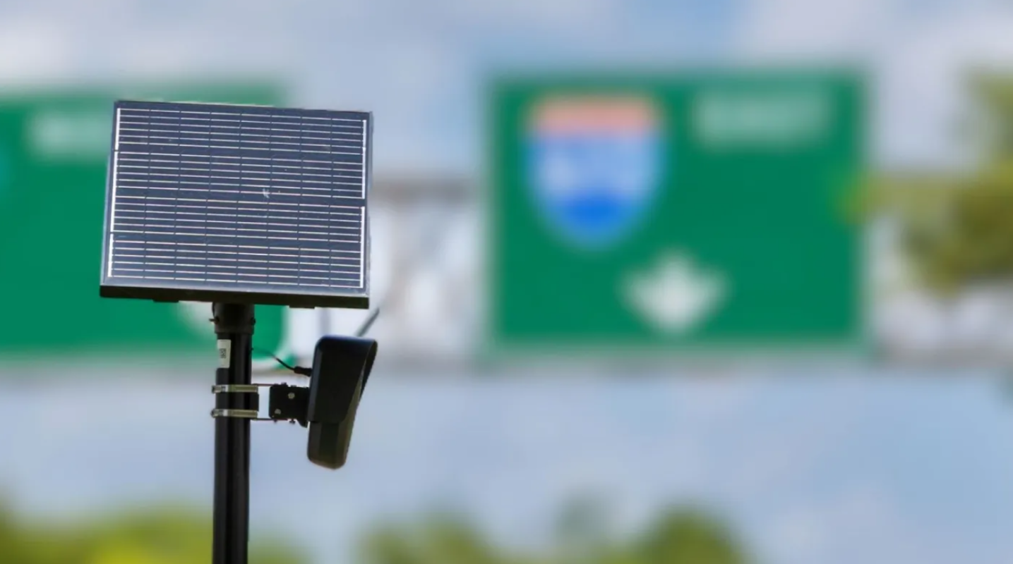 A Flock camera on a highway.
