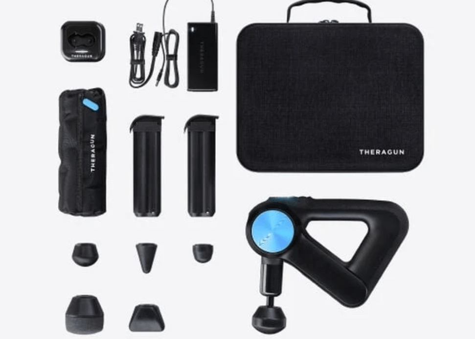 A black massage gun and accessories.