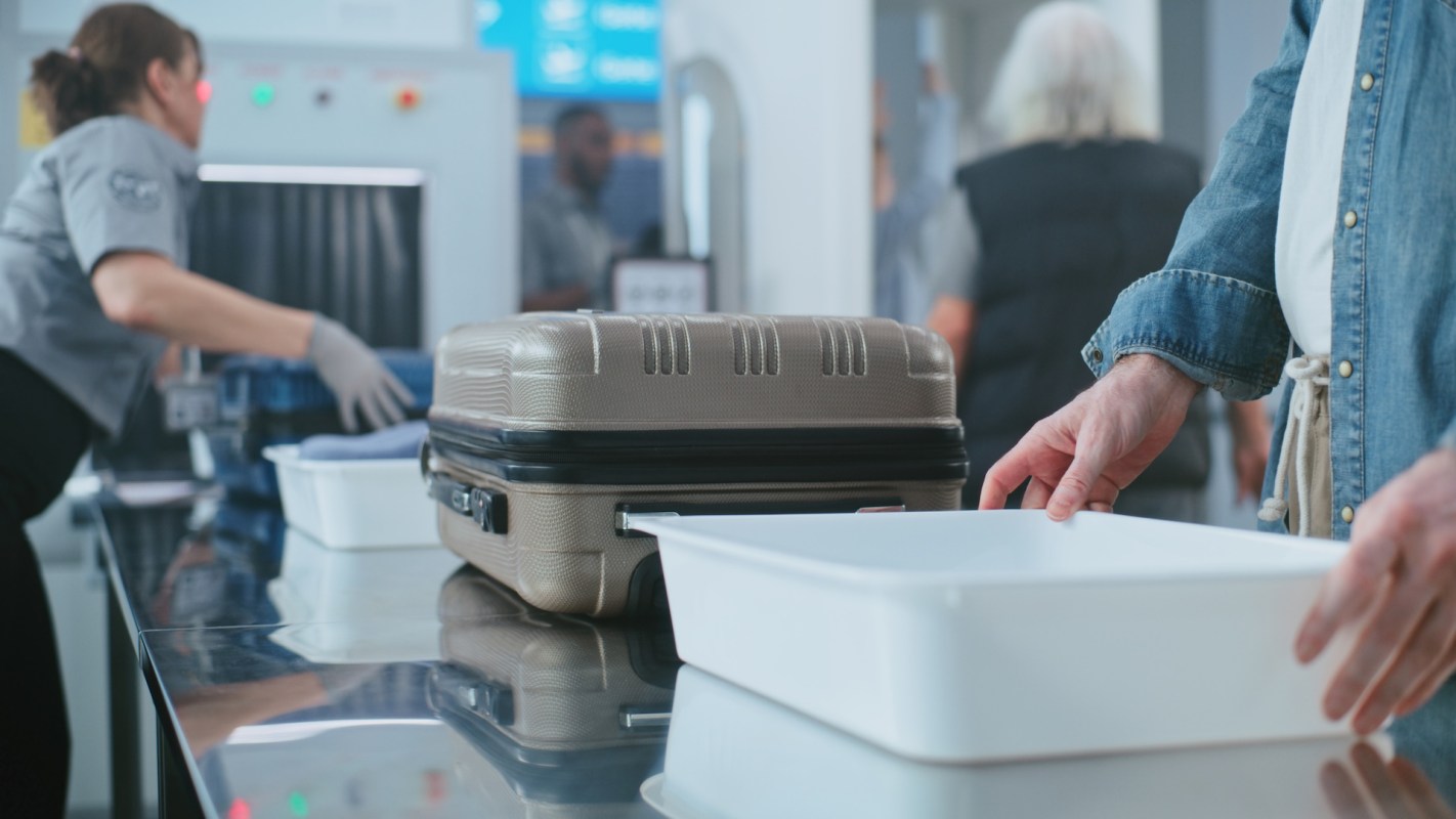 An airport traveler at a security checkpoint.
