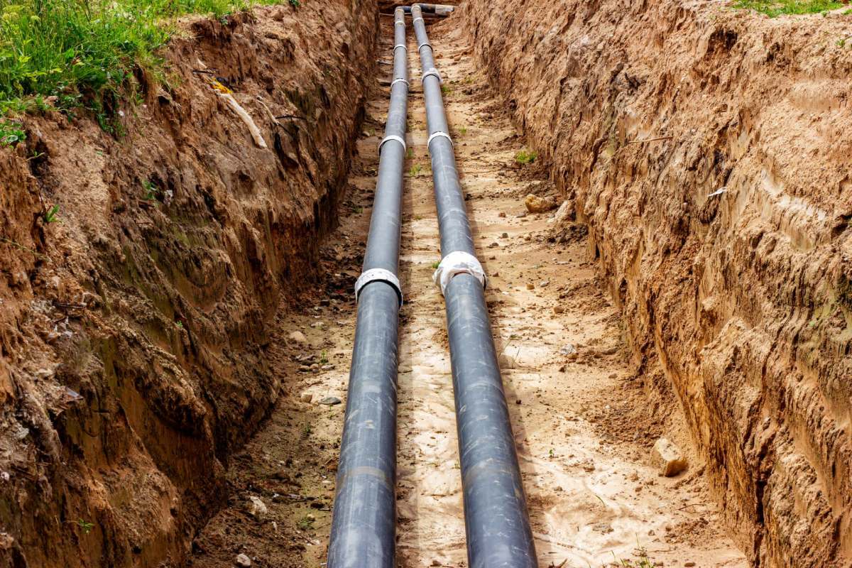 Installing water pipes in the ground.