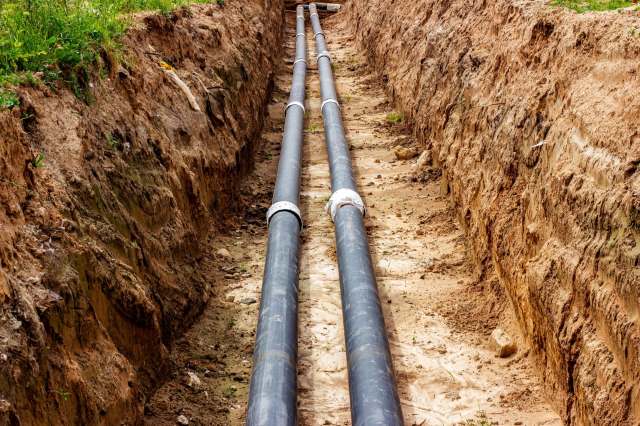 Installing water pipes in the ground.