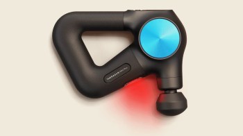 A black massage gun with a blue control panel and a red light at the tip.