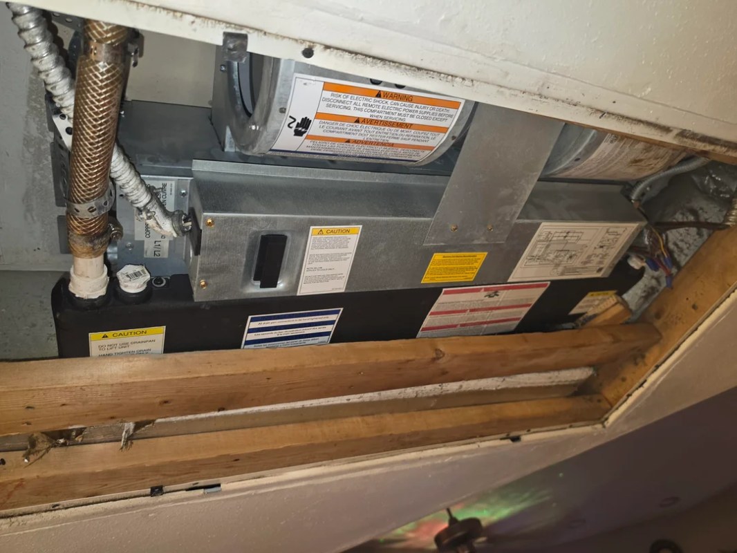 An AC unit in a closet.