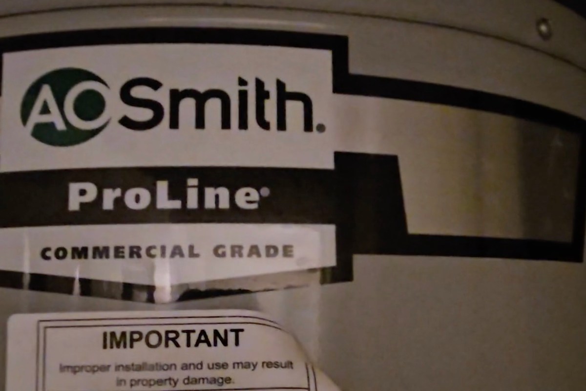 A label on a water heater featuring the A. O. Smith logo and "ProLine Commercial Grade."