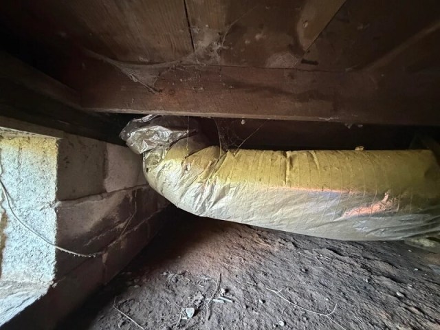 Flex ducting in a crawl space.
