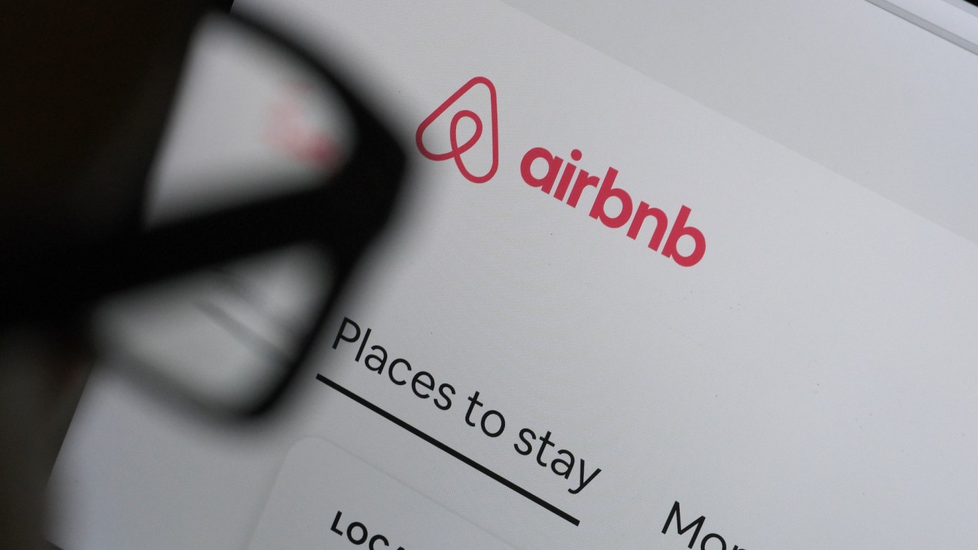The Airbnb website displaying the logo and options for accommodation.