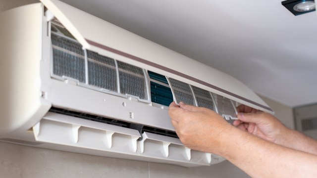 Indoor Air Conditioning Unit Under Filter Maintenance.