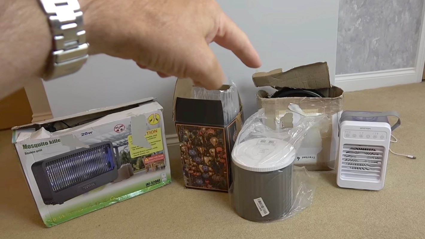 A person pointing at returned products.