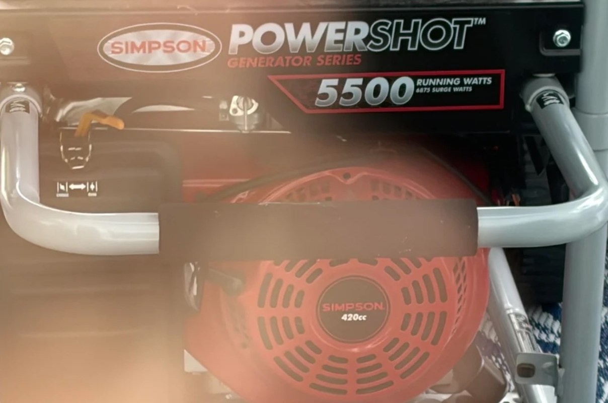 A Simpson Powershot generator showing specifications and a red engine.