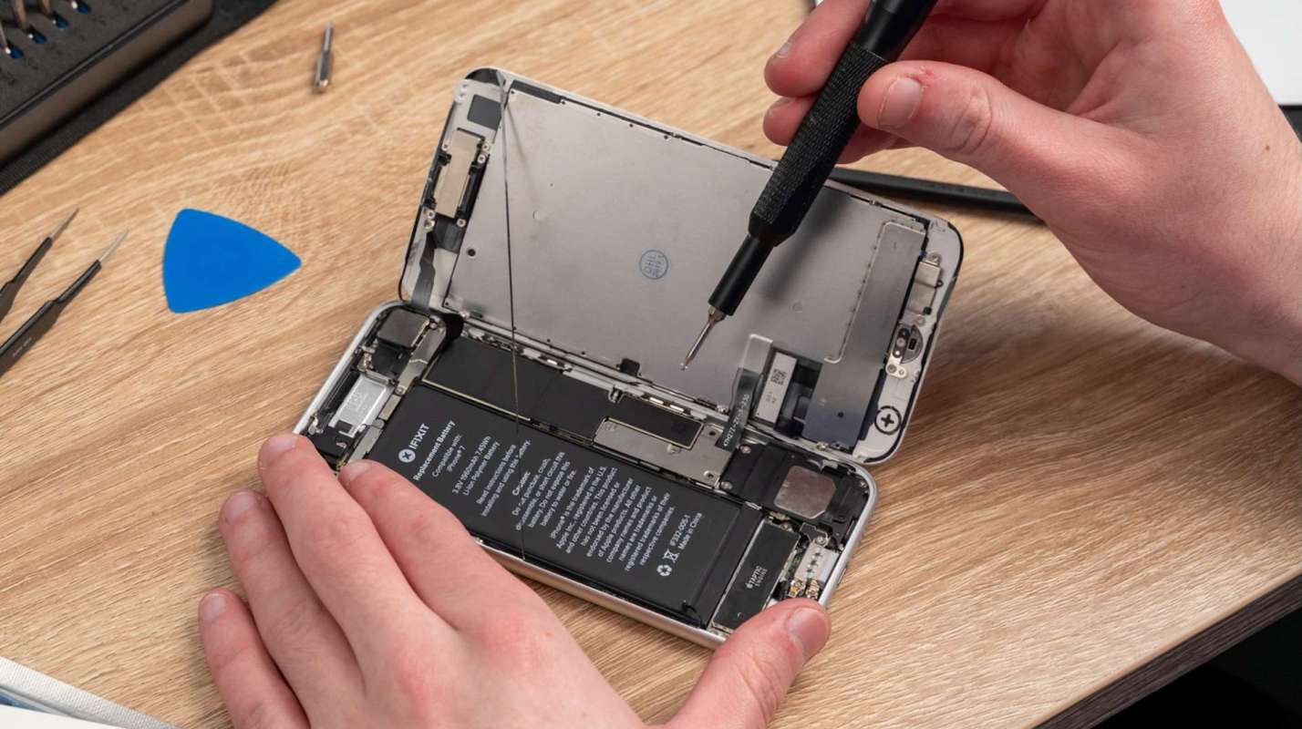 A person repairing a smartphone.